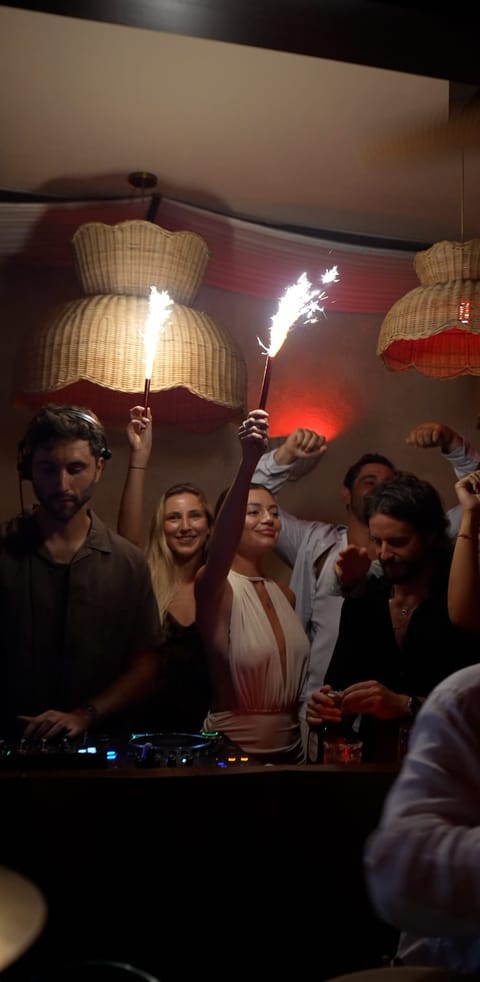 Sparklers in the Club 55 crowd