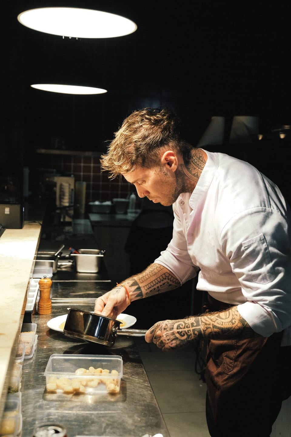 A chef cooking at the pass in the Giselle kitchen