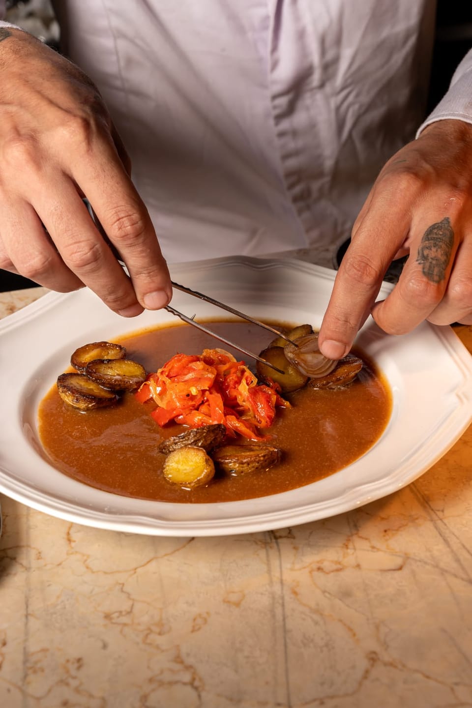 The last pieces placed on the plate with tweezers